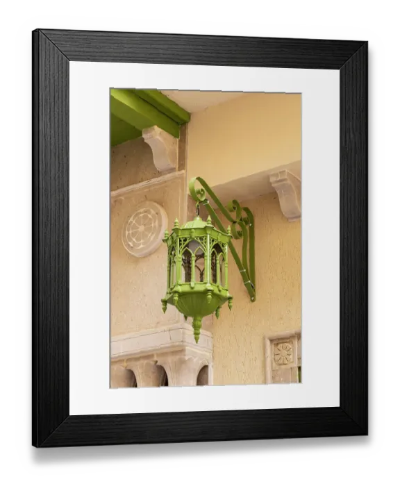 Framed Print : Kairouan, Tunisia. A green metal lamp hanging from a building