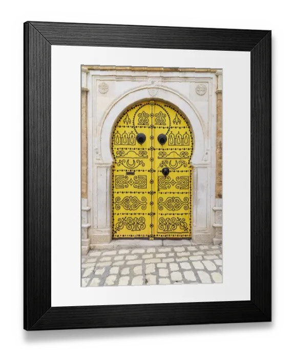 Framed Print : Tunis, Tunisia. A decorated door in a keyhole arch, also known as a Moorish Arch