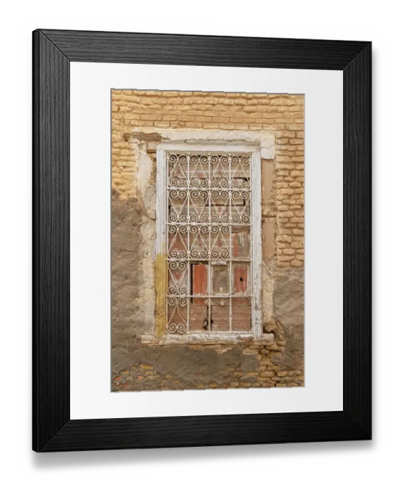 Framed Print : Bir Al Huffay, Sidi Bouzid, Tunisia. Decorative barred window on a brick building