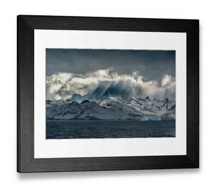 Framed Print : South Georgia Island. Opening in clouds and Virga reveal the mountainous and glaciated landscape Framed Print : South Georgia Island. Opening in clouds and Virga reveal the mountainous and glaciated landscape