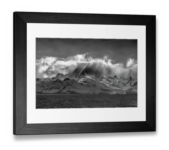 Framed Print : South Georgia Island. Opening in clouds and Virga reveal the mountainous and glaciated landscape Framed Print : South Georgia Island. Opening in clouds and Virga reveal the mountainous and glaciated landscape