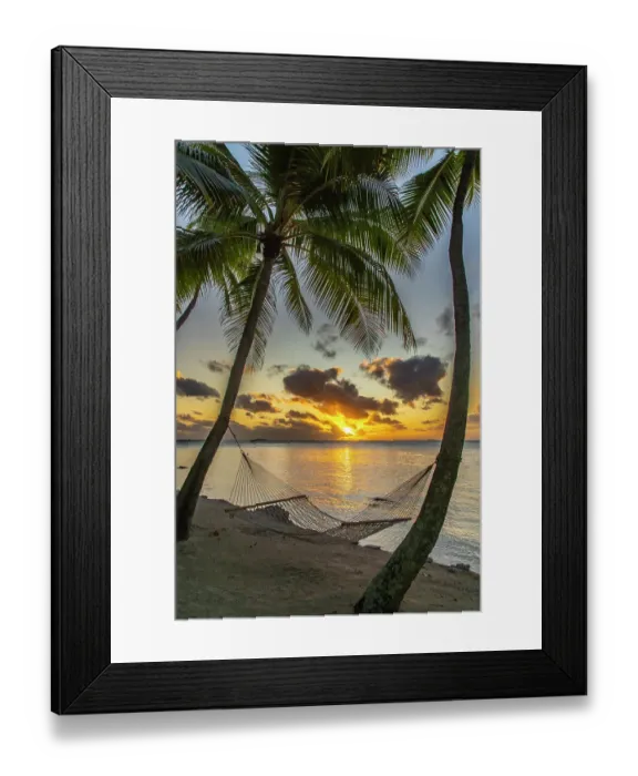 Framed Print : French Polynesia, Tikehau Atoll. Sunset on hammock between palm trees and ocean. ©Cathy & Gordon Illg  /  Jaynes Gallery  /  DanitaDelimont.com