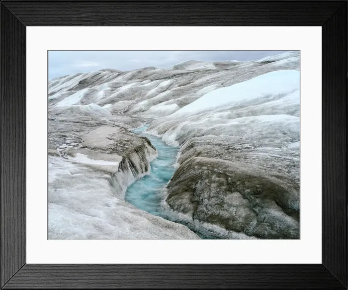 Framed Print : Drainage system on the surface of the ice sheet. The brown sediment on the ice is created by the rapid melting of the ice. Landscape of Greenland near Kangerlussuaq, Kingdom of Denmark