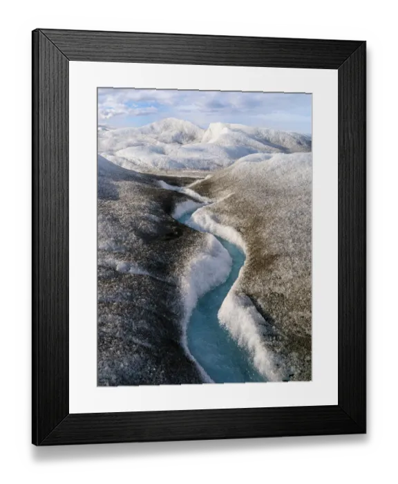 Framed Print : Drainage system on the surface of the ice sheet. The brown sediment on the ice is created by the rapid melting of the ice. Landscape of Greenland near Kangerlussuaq, Kingdom of Denmark