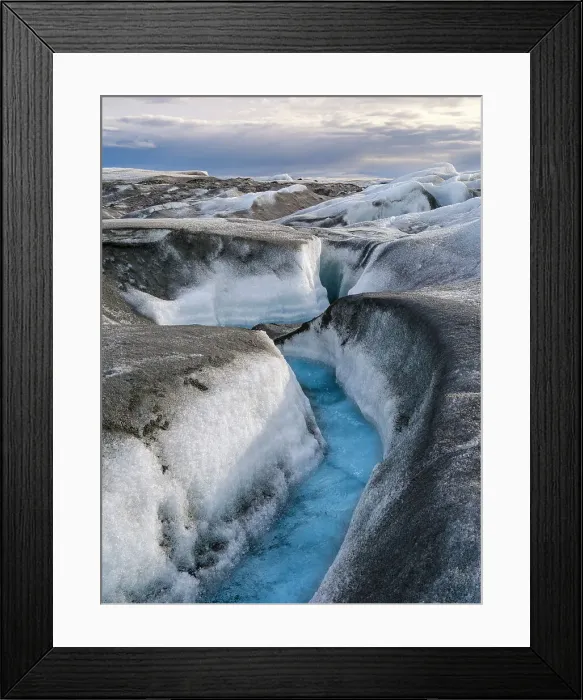 Framed Print : Drainage system on the surface of the ice sheet. The brown sediment on the ice is created by the rapid melting of the ice. Landscape of Greenland near Kangerlussuaq, Kingdom of Denmark Framed Print : Drainage system on the surface of the ice sheet. The brown sediment on the ice is created by the rapid melting of the ice. Landscape of Greenland near Kangerlussuaq, Kingdom of Denmark