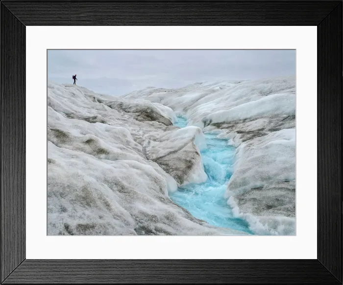 Framed Print : Tourists hiking on the ice. The brown sediment on the ice is created by the rapid melting of the ice. Landscape of Greenland near Kangerlussuaq, Kingdom of Denmark