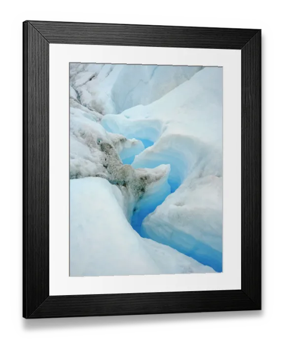 Framed Print : Drainage system on the surface of the ice sheet. The brown sediment on the ice is created by the rapid melting of the ice. Landscape of Greenland near Kangerlussuaq, Kingdom of Denmark