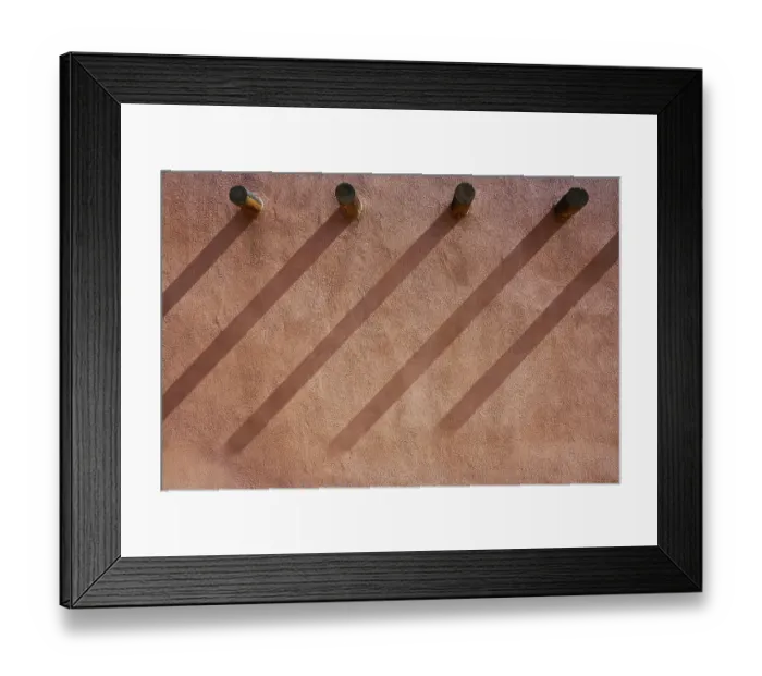 Framed Print : North America, United States, New Mexico, Albuquerque. Shadows angle down from structural wood support beams onto an adobe stucco wall in Old Town, Albuquerque Framed Print : North America, United States, New Mexico, Albuquerque. Shadows angle down from structural wood support beams onto an adobe stucco wall in Old Town, Albuquerque