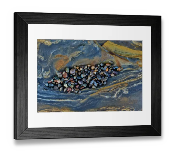 Framed Print : USA, California, Point Lobos State Natural Reserve. Blue and gold tone rocks at low tide with colorful small pebbles