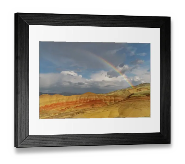 Framed Print : Rainbow and Stormy light over the Painted Hills at the John Day Fossil Beds National Monument near Mitchell, Oregon, USA
