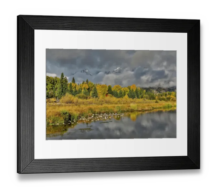 Framed Print : USA, Wyoming. Grand Tetons National Park view of Teton Mountains as they peak through the morning clouds from Schwabacher Landing in reflections