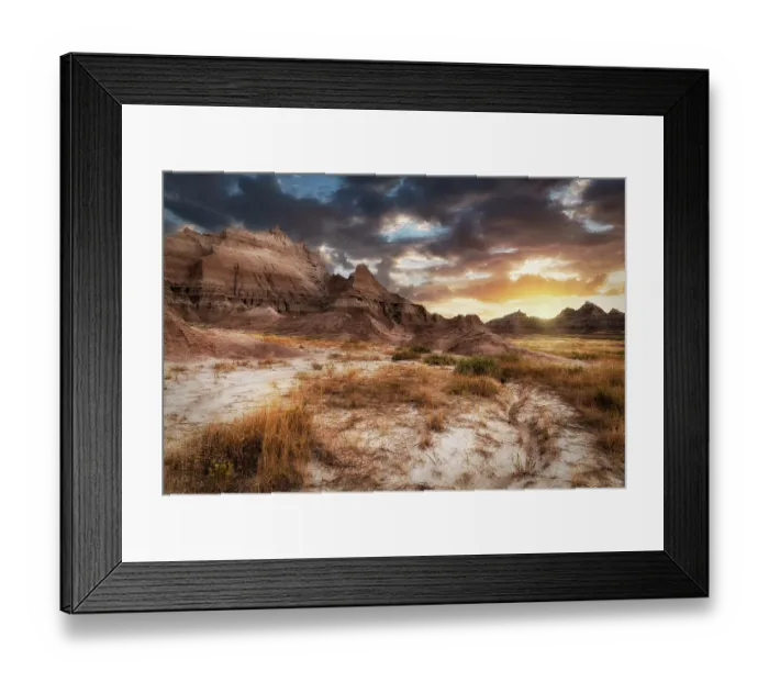 Framed Print : Sunset in dramatic skies over the hoodoo peaks of the Badlands Framed Print : Sunset in dramatic skies over the hoodoo peaks of the Badlands
