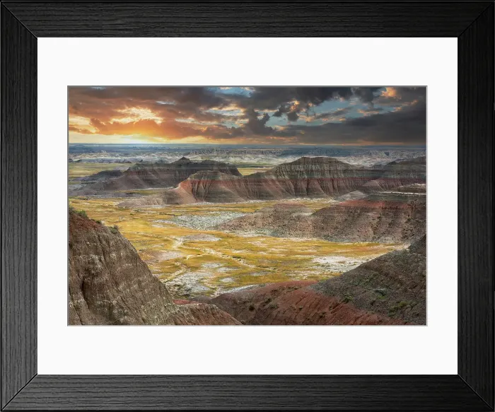 Framed Print : The pink striped peaks or hoodoos are layered with a grass valley, at sunset Framed Print : The pink striped peaks or hoodoos are layered with a grass valley, at sunset