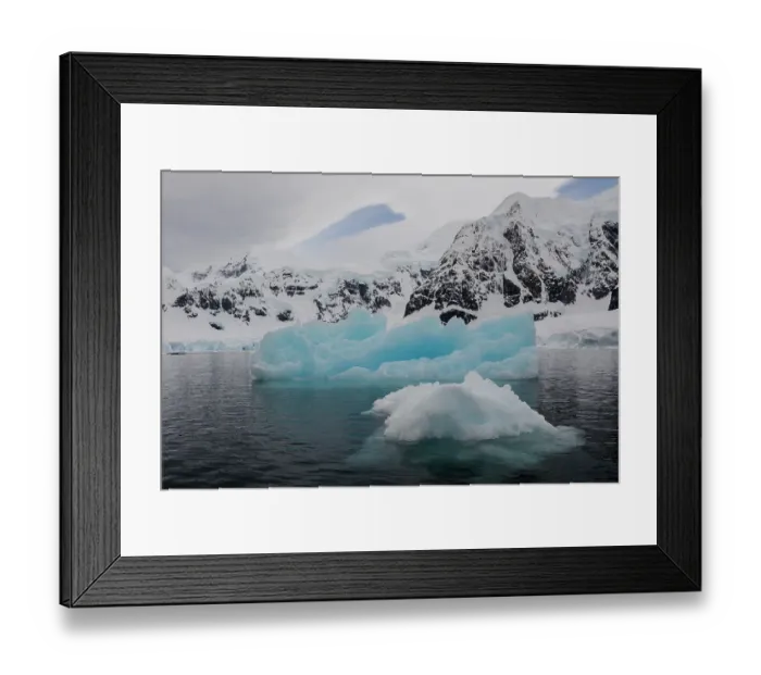 Framed Print : Southern Ocean, Antarctica. Paradise Bay is filled with brash ice and larger icebergs and is surrounded by snowy mountains