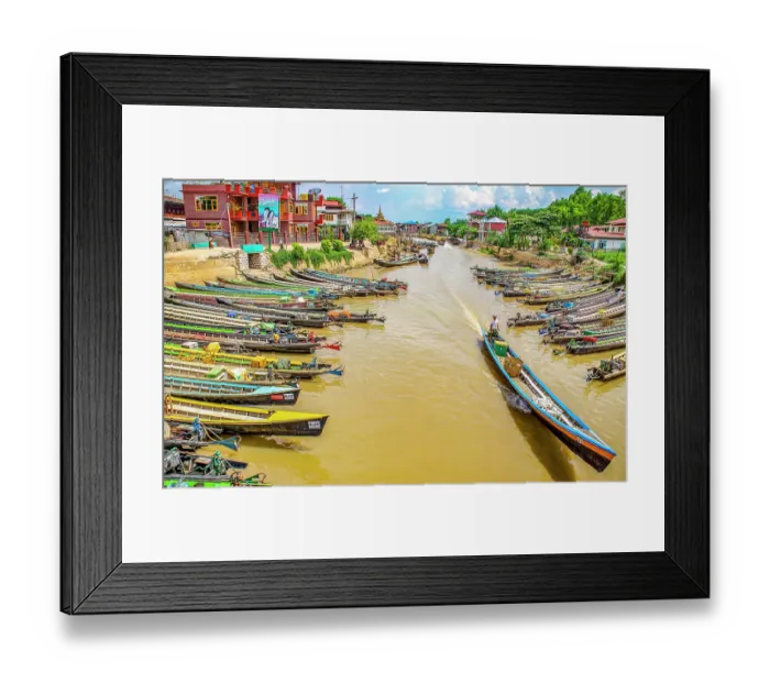 Framed Print : Nyaungshwe, Myanmar. Wide angle landscape view of long motor boats lining the canal which runs into Inle Lake Framed Print : Nyaungshwe, Myanmar. Wide angle landscape view of long motor boats lining the canal which runs into Inle Lake