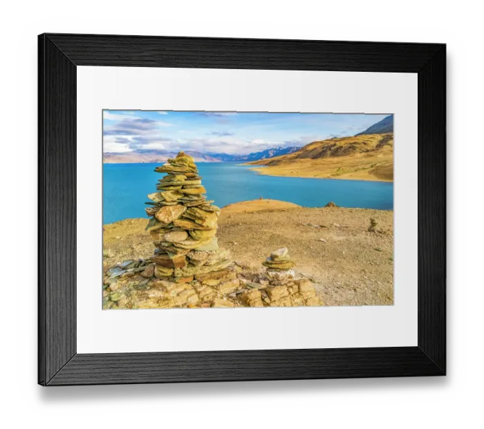 Framed Print : Lake, Ladakh, India. Landscape view of stone cairns overlooking high altitude lake with Himalaya Mountains in background Framed Print : Lake, Ladakh, India. Landscape view of stone cairns overlooking high altitude lake with Himalaya Mountains in background