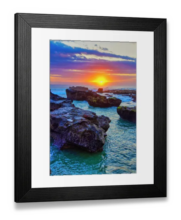 Framed Print : Lava Rock outcroppings in the shallow seas at Cemagi Beach on the west coast at Cemagi, Bali, Indonesia