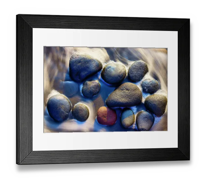 Framed Print : Lava beach rocks worn by centuries of sea water cover the black sand beaches of Bali