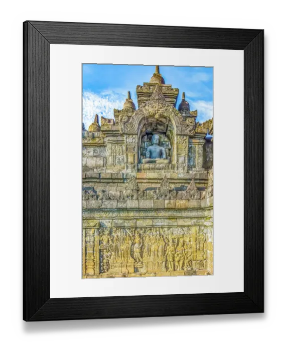 Framed Print : Java, Indonesia. Close-up detail of one of the original 504 statues of Buddha in a carved niche of Borobudur Temple