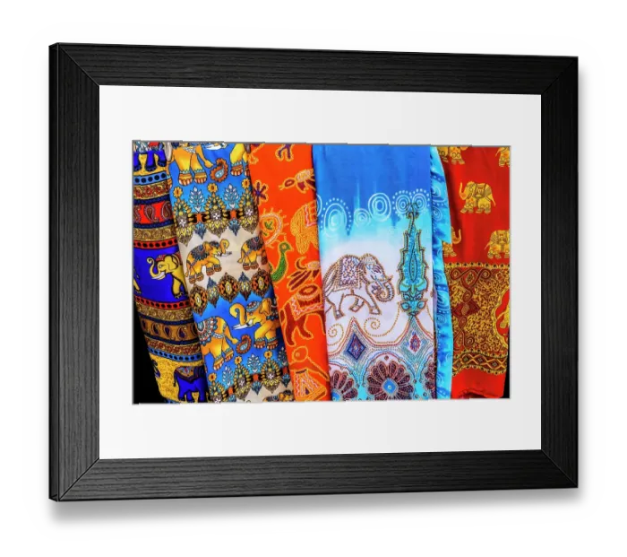 Framed Print : Colorful elephant pants souvenir, Bangkok, Thailand. A popular souvenir that are light and airy in hot climate