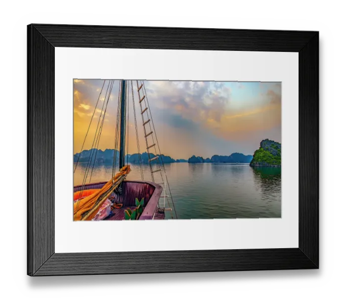 Framed Print : Ha Long Bay, Vietnam. Wide angle landscape view of tourist boat at sunset among the limestone karsts and islets Framed Print : Ha Long Bay, Vietnam. Wide angle landscape view of tourist boat at sunset among the limestone karsts and islets