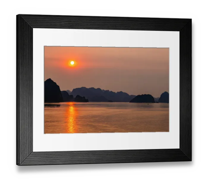 Framed Print : Ha Long Bay, Vietnam. Wide angle landscape view of fishing boats at sunset among the limestone karsts and islets of the UNESCO Heritage Site