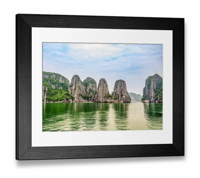 Framed Print : Ha Long Bay, Vietnam. Landscape view of tourist boat cruising among limestone karsts and islets in famous bay of turquoise waters Framed Print : Ha Long Bay, Vietnam. Landscape view of tourist boat cruising among limestone karsts and islets in famous bay of turquoise waters