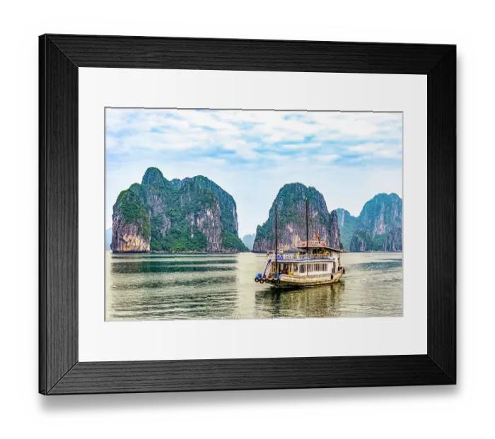 Framed Print : Ha Long Bay, Vietnam. Landscape view of tourist boat cruising among limestone karsts and islets in famous UNESCO Site Framed Print : Ha Long Bay, Vietnam. Landscape view of tourist boat cruising among limestone karsts and islets in famous UNESCO Site