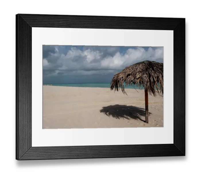 Framed Print : Varadero Beach, Cuba. The empty tropical beach clad with thatched umbrellas for tourists