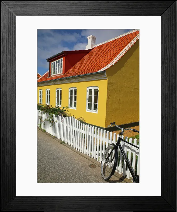 Framed Print : Skagen, Denmark. Bike, yellow house with white picket fence and terra cotta roof. (Editorial Use Only) Framed Print : Skagen, Denmark. Bike, yellow house with white picket fence and terra cotta roof. (Editorial Use Only)