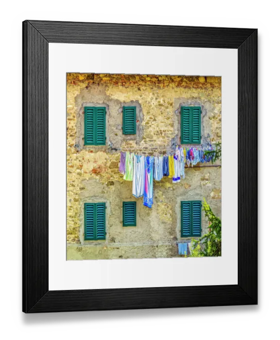 Framed Print : Greve in Chianti, Tuscany, Italy. View of family laundry hanging against a stone wall with green shuttered windows in an ancient town Framed Print : Greve in Chianti, Tuscany, Italy. View of family laundry hanging against a stone wall with green shuttered windows in an ancient town