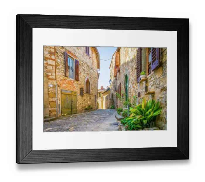 Framed Print : Greve in Chianti, Tuscany, Italy. Wide angle view of ancient buildings on cobbled street showing stonework walls Framed Print : Greve in Chianti, Tuscany, Italy. Wide angle view of ancient buildings on cobbled street showing stonework walls