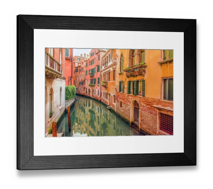 Framed Print : Canal, Venice, Italy. Wide angle view of the colorful, medieval buildings reflecting in the canal Framed Print : Canal, Venice, Italy. Wide angle view of the colorful, medieval buildings reflecting in the canal