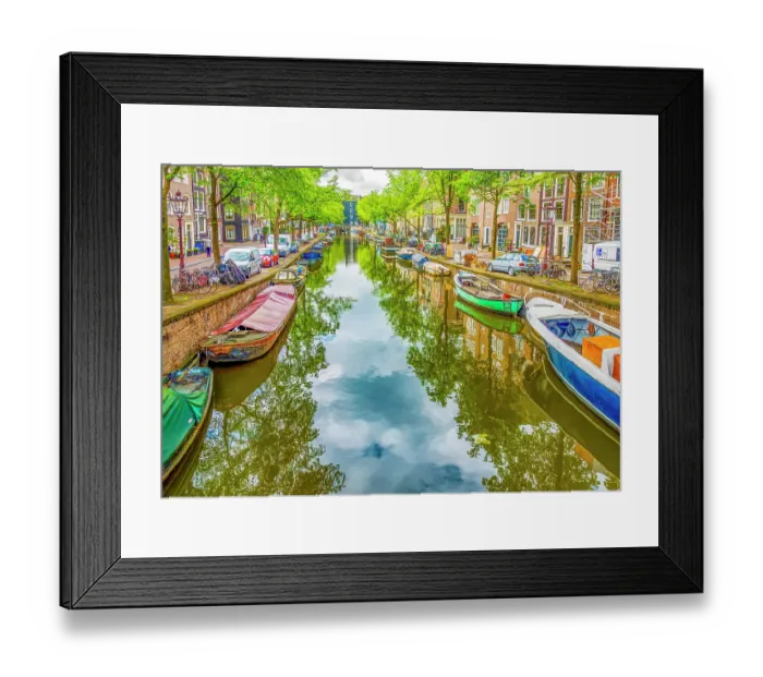 Framed Print : Amsterdam, Netherlands. Wide angle view of houseboats, motor boats and sail boats lining a canal on a summer day