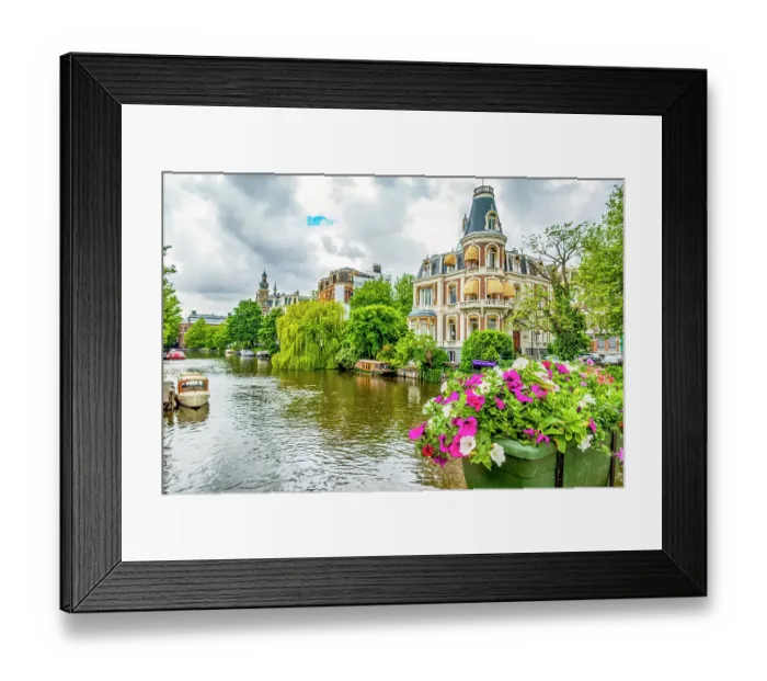 Framed Print : Amsterdam, Netherlands. Wide angle view of historic houses on tree and flower lined canal Framed Print : Amsterdam, Netherlands. Wide angle view of historic houses on tree and flower lined canal