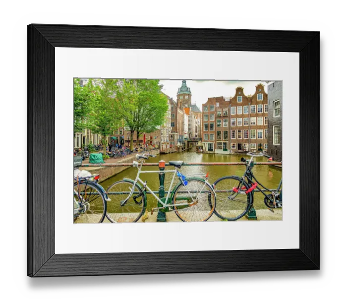 Framed Print : Amsterdam, Netherlands. Wide angle landscape view of two canals merging to form a corner for historical buildings