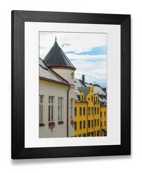 Framed Print : Alesund, Norway. Art deco architecture, colorful yellow narrow buildings with scalloped roofs Framed Print : Alesund, Norway. Art deco architecture, colorful yellow narrow buildings with scalloped roofs