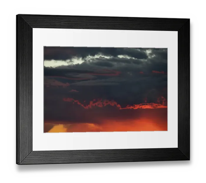 Framed Print : Sunset turns cumulus clouds bright red and orange