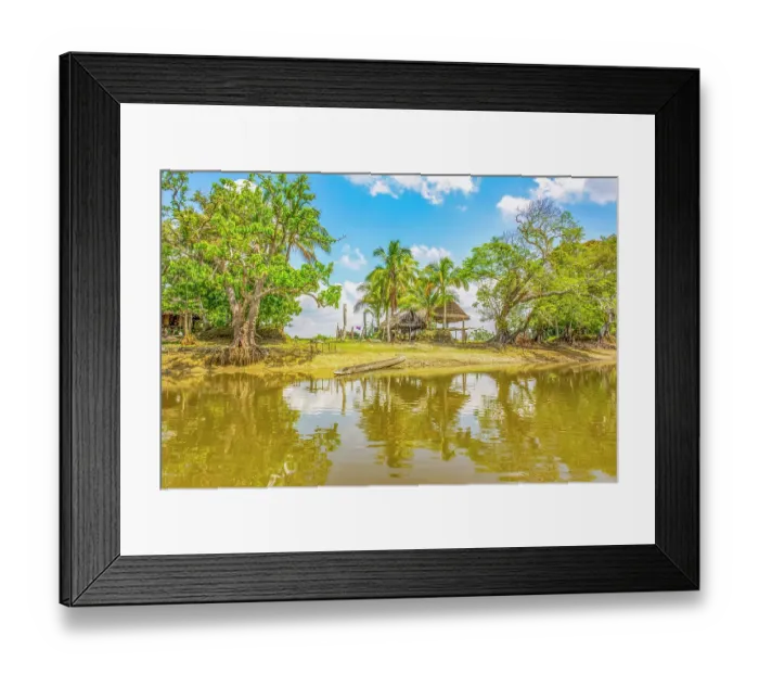 Framed Print : Sepik River, Papua New Guinea. Landscape view of a homestead and sandy banks reflected along the river