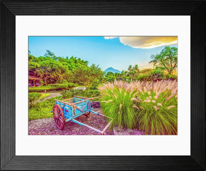 Framed Print : Antigua, Guatemala. Wide angle view at sunset of Volcan Fuego above a garden Framed Print : Antigua, Guatemala. Wide angle view at sunset of Volcan Fuego above a garden