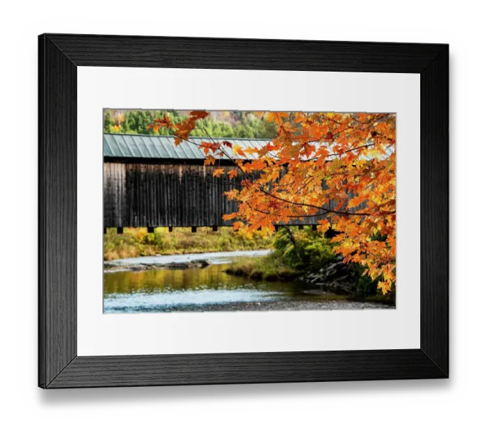 Framed Print : USA, Vermont, Mad River Valley. Waitsfield covered bridge, maple leaves in fall foliage, Mad River