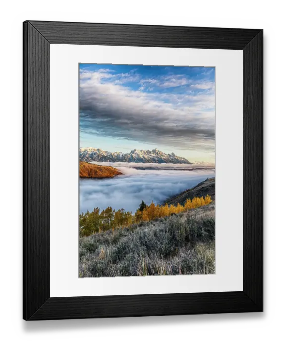 Framed Print : A temperature inversion cause a layer of fog to form in the valley below the peaks of Grand Teton National Park