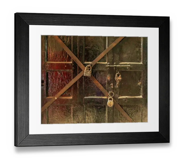 Framed Print : Close-up of wooden door with multiple padlocks