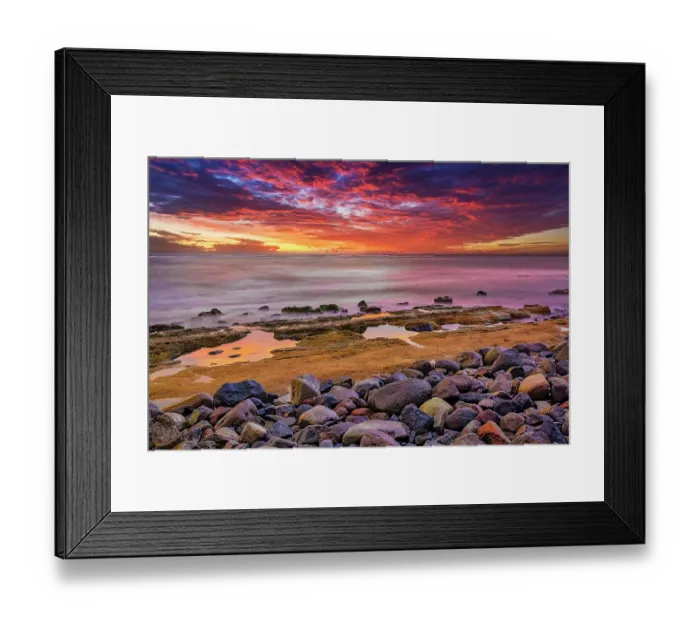 Framed Print : Bali's sunsets are often considered postcard-perfect, with their stunning colors and breathtaking scenery. Here is a Black and White at sunset high tide