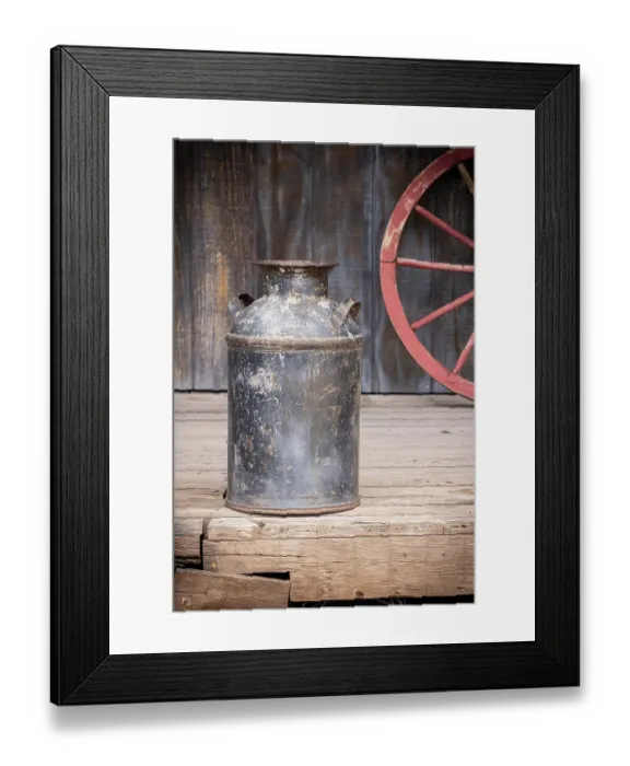 Framed Print : Still-life of old milk can and wagon wheel Framed Print : Still-life of old milk can and wagon wheel