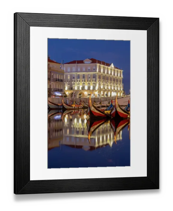 Framed Print : Gondola style fishing tour boats in canal in Aveiro, Portugal Framed Print : Gondola style fishing tour boats in canal in Aveiro, Portugal