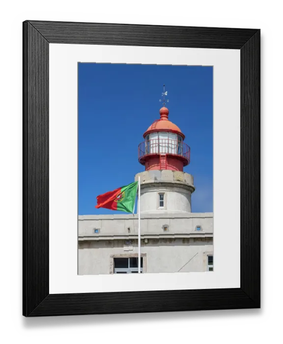 Framed Print : Ponta Delgada, Azores, Portugal. Portuguese flag and Albarnaz Lighthouse on Flores Island