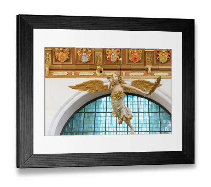 Framed Print : Germany, Mecklenburg-Vorpommern, Stralsund. St. Mary's Church interior, UNESCO World Heritage Site. Hanging figure of angel blowing trumpet. (Editorial Use Only)