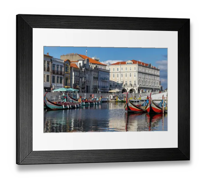 Framed Print : Gondola style fishing tour boats in canal in Aveiro, Portugal. (Editorial Use Only) Framed Print : Gondola style fishing tour boats in canal in Aveiro, Portugal. (Editorial Use Only)