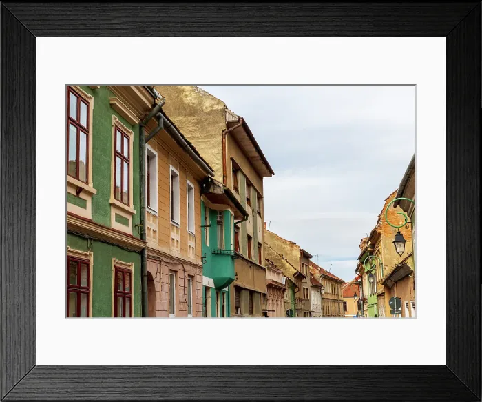 Framed Print : Romania Brasov. 16th century arcaded, and terra cotta roofed houses and narrow streets